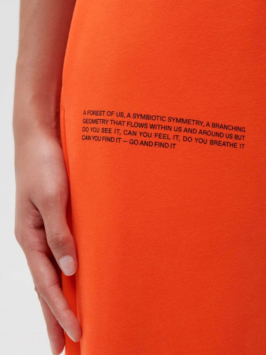 A poem imprinted on orange trousers