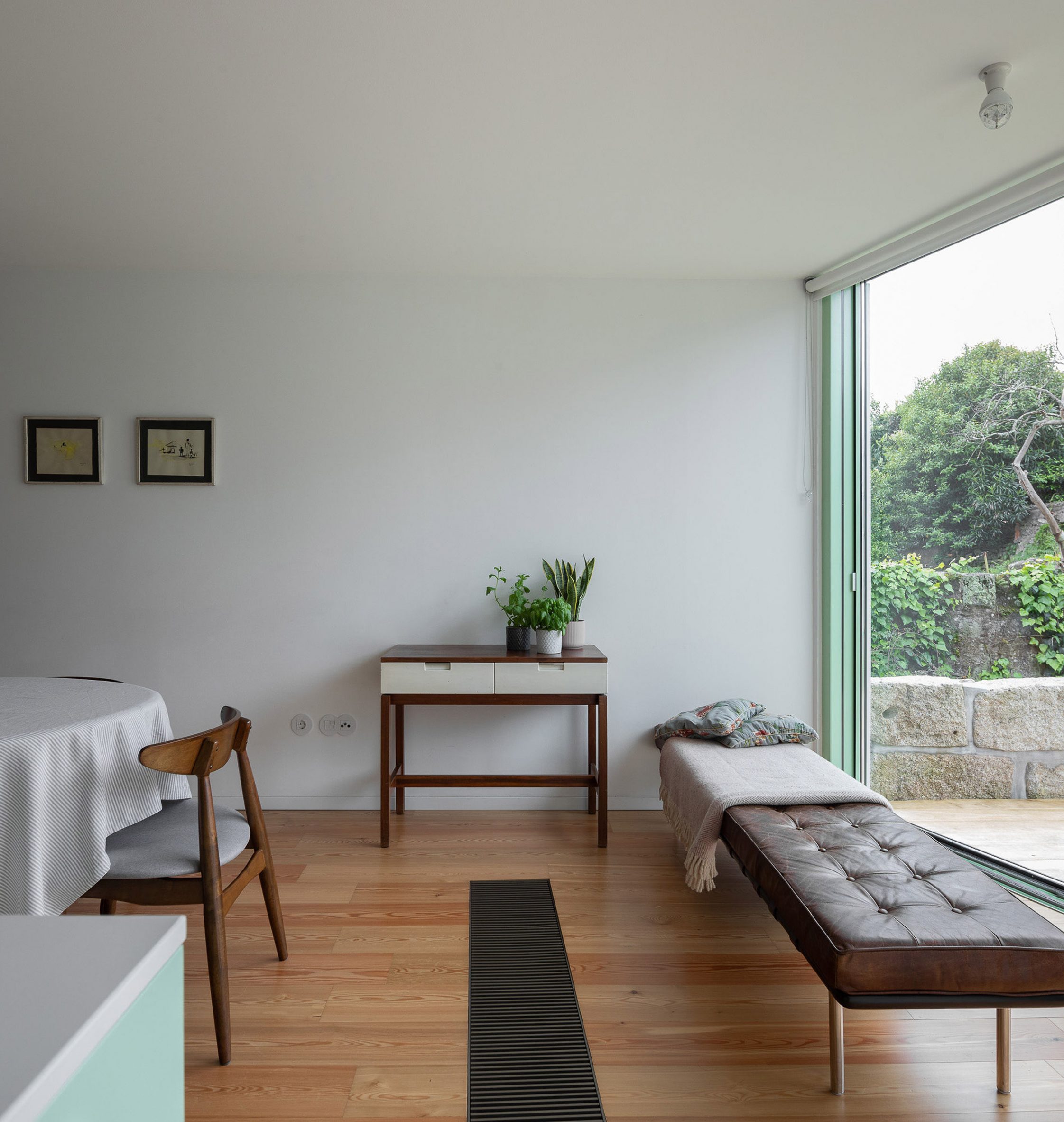 Wooden floor in living room with glazed wall