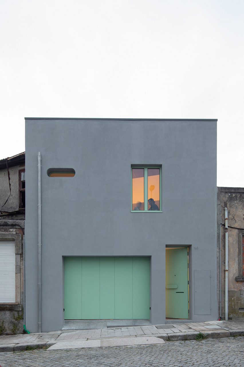 Gray house in Porto with turquoise doors by Fahr 021.3