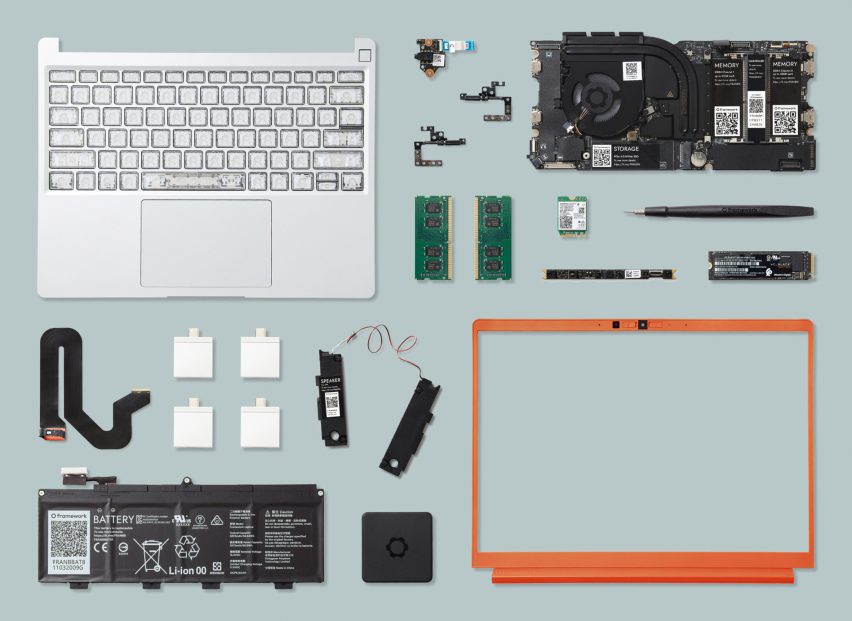 Flatlay of the constituent components of a modular laptop including the keyboard and motherboard