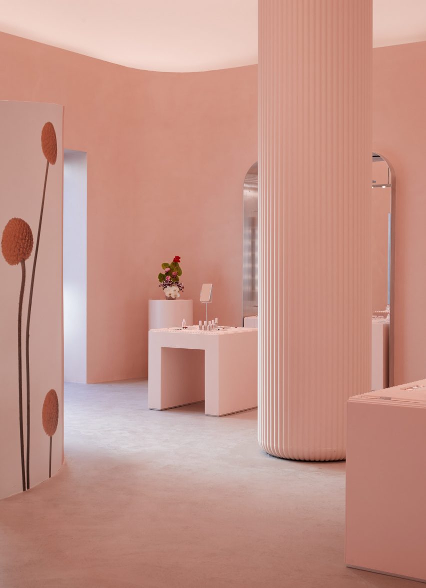 Pink fluted columns in Glossier store LA