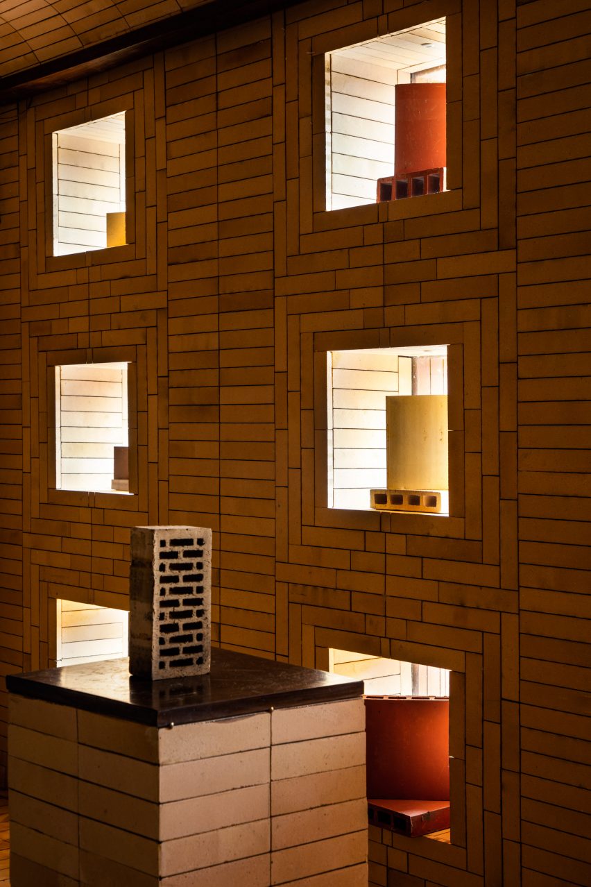 Bricks displayed on plinths and in square windows of showroom by Renesa
