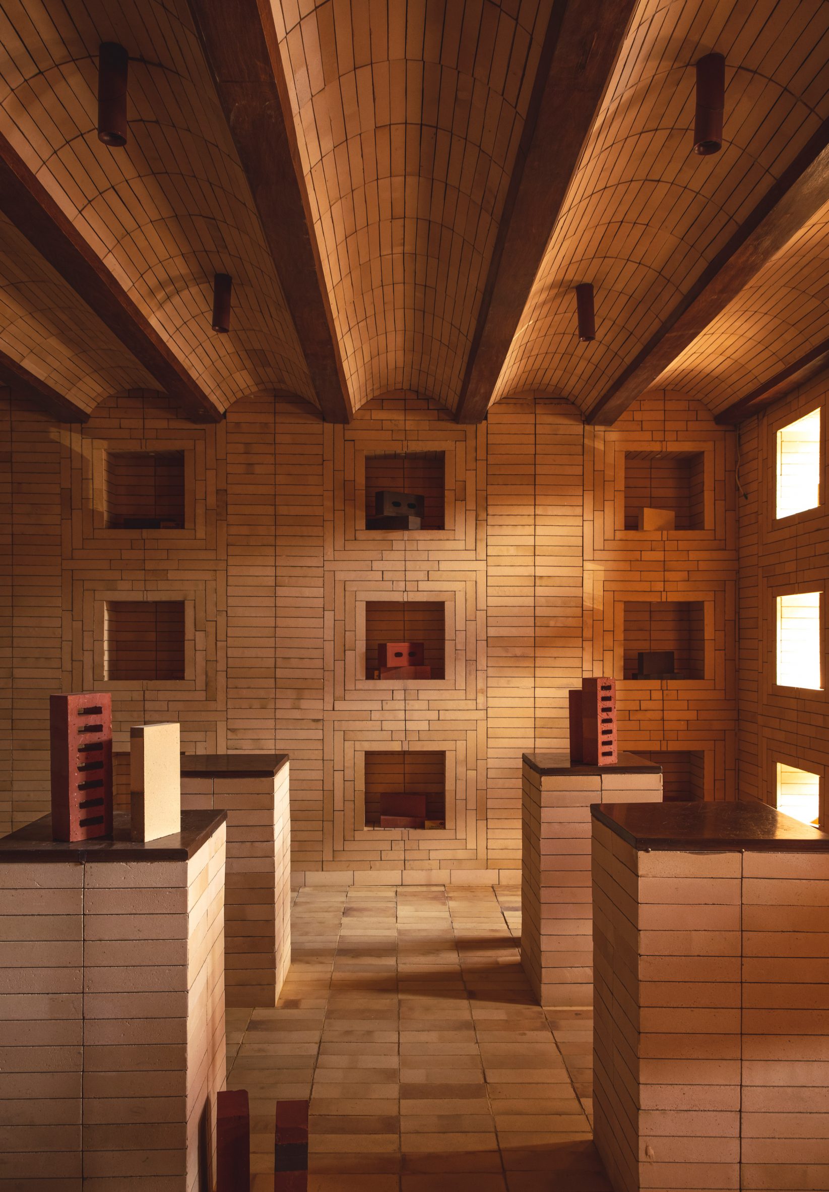  Indal Mechno Bricks displayed in square wall niches and on tall plinths made from bricks