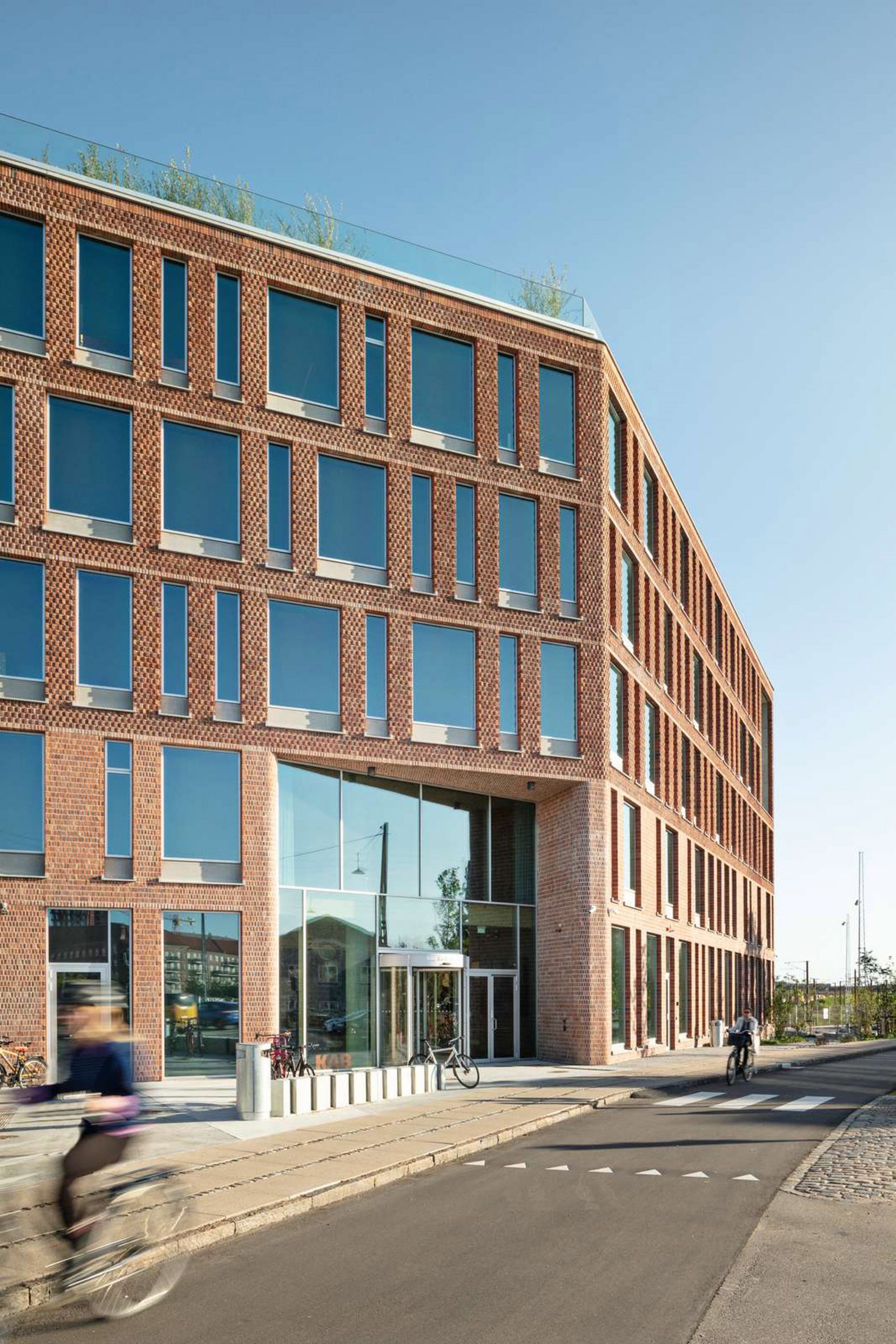 Red brick exterior of KAB headquarters in Copenhagen