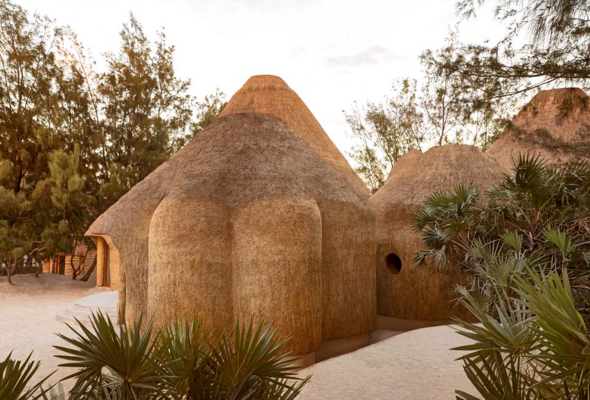 Thatched volumes of the wellness center