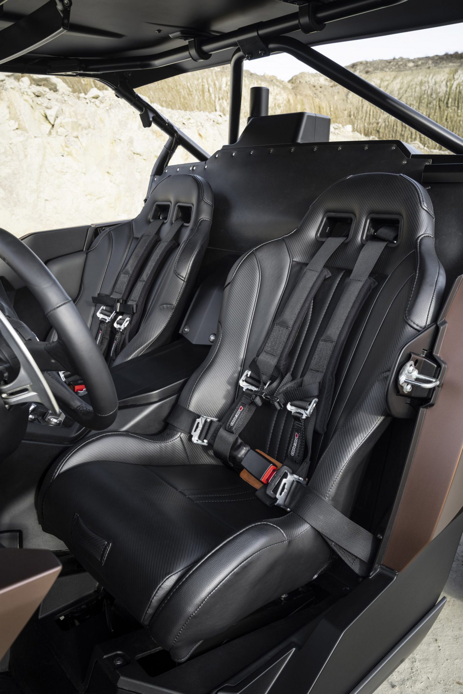 Fake leather seats with five-point seatbelts in hydrogen-powered buggy by Lexus
