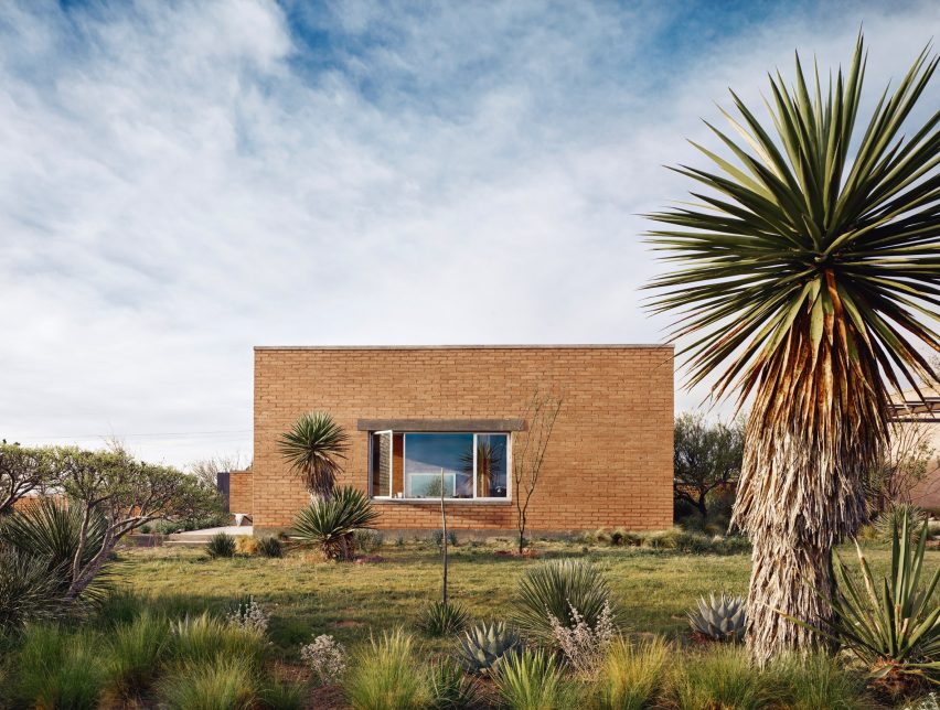 The exterior of Marfa Studio and a palm tree