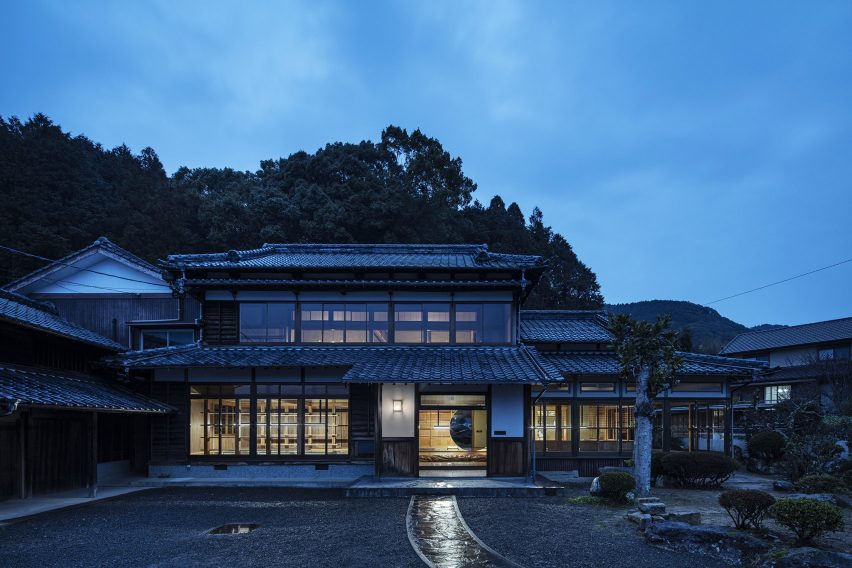 Exterior of Maruhiro office in converted Japanese house at dusk