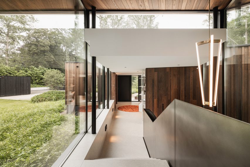 Corridor of Modern House by the River by Maas Architecten