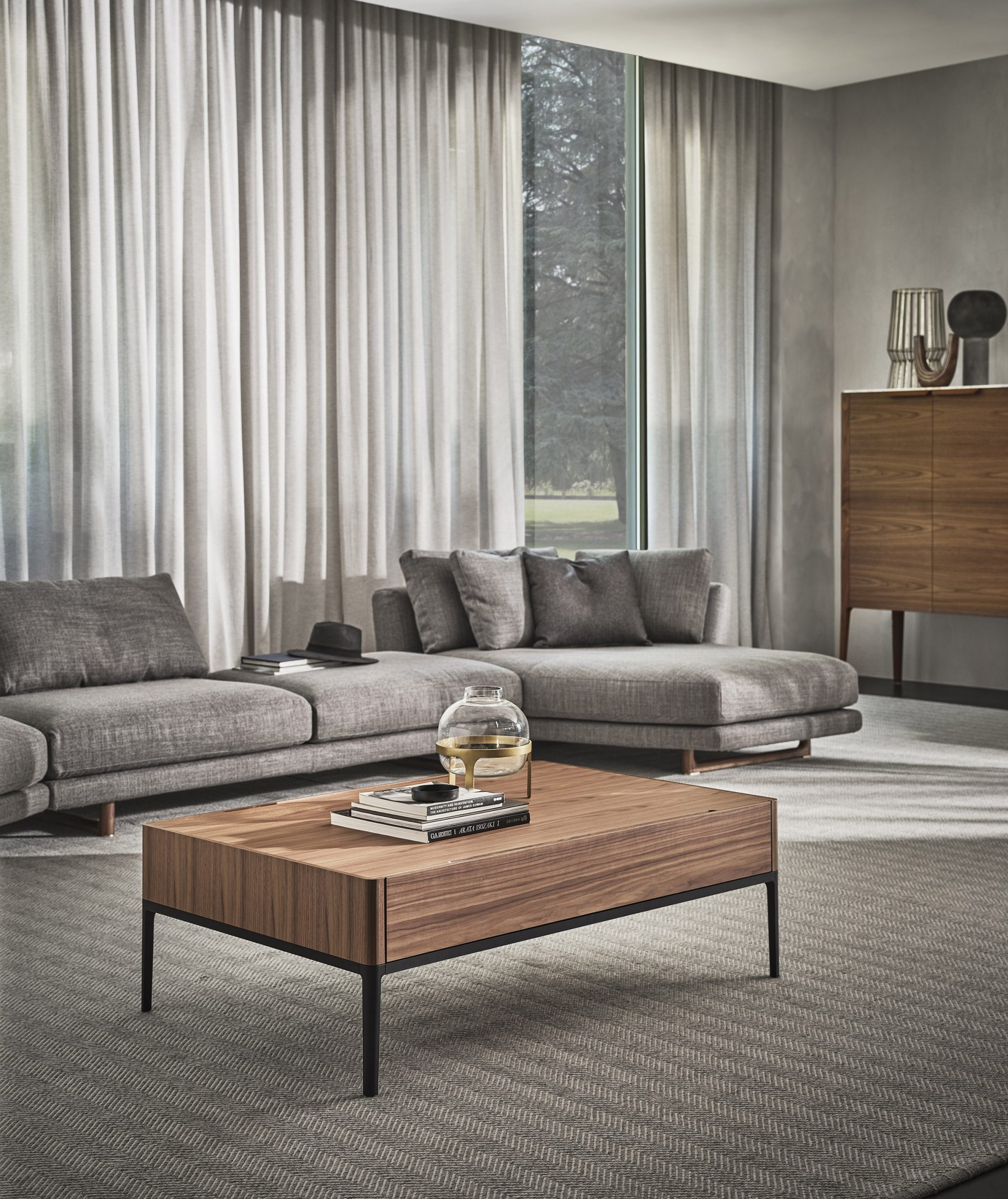 A living room with furniture by Porada