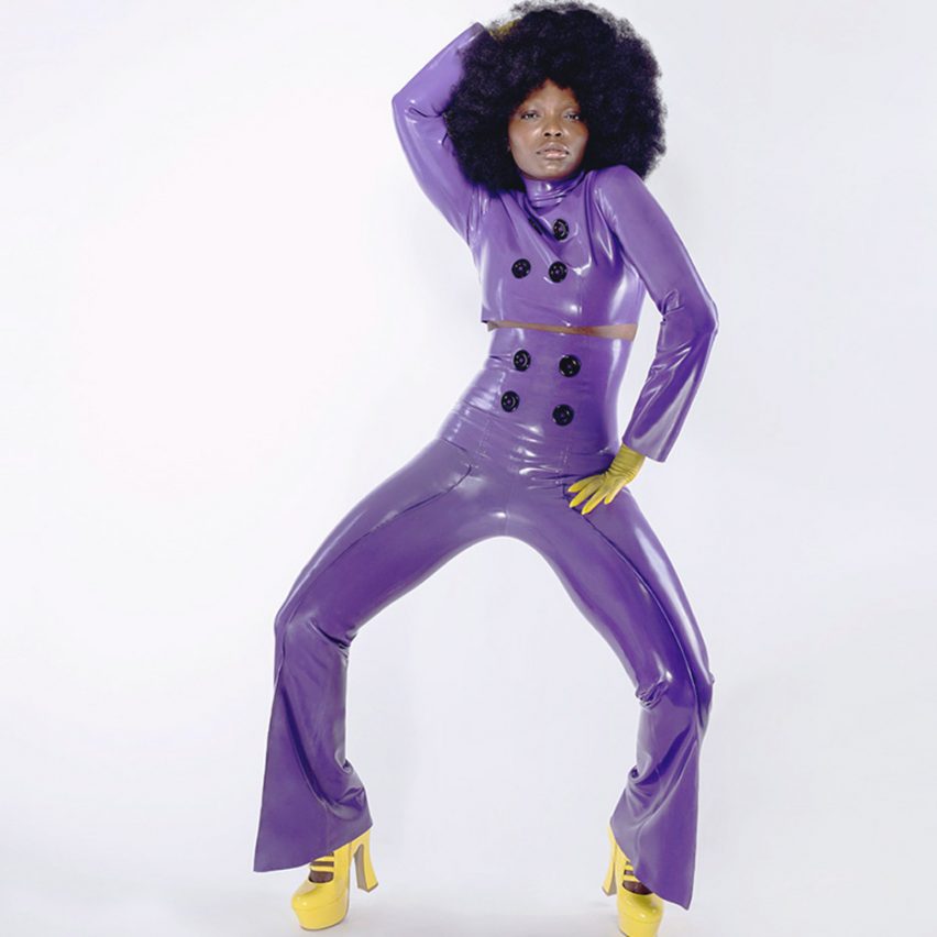 A woman modelling a purple latex suit