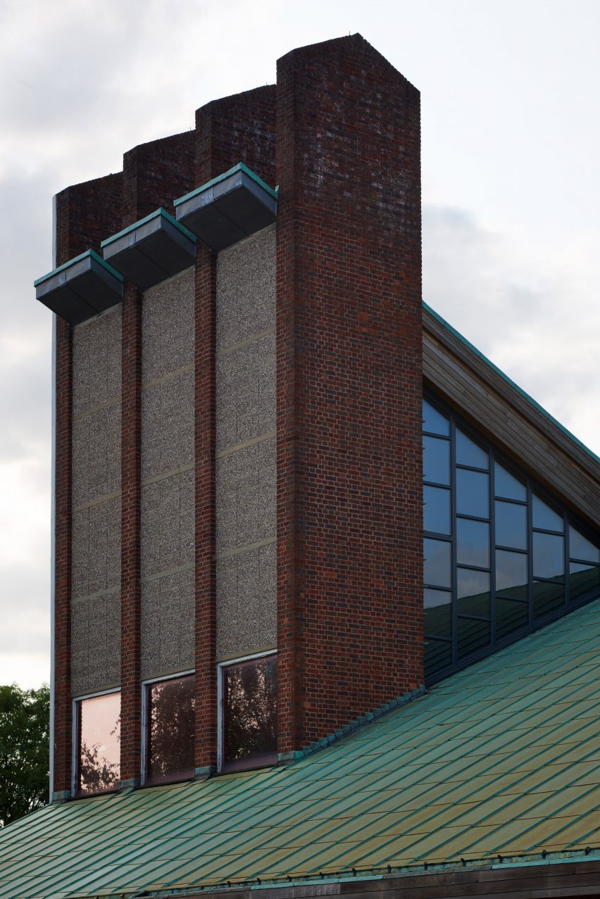Exterior detail of St John Chrysostom church showing coloured glass and red brick facade