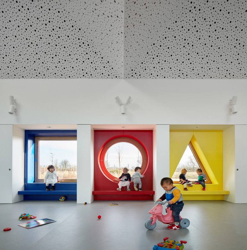 Children play in a kindergarten with colourful alcoves