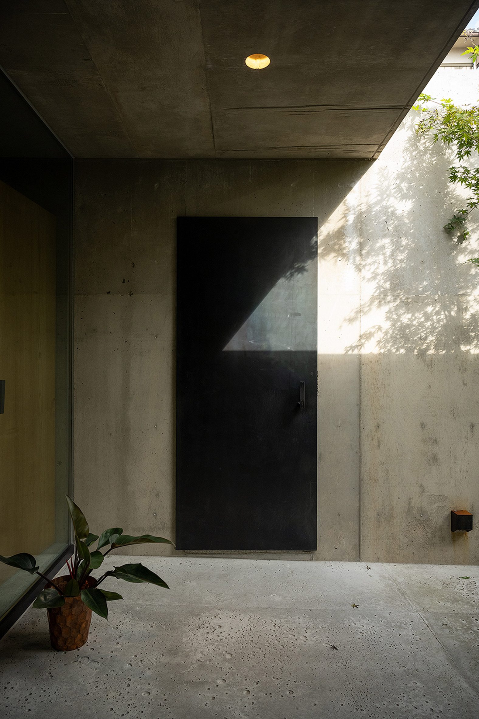 Concrete walls with black door