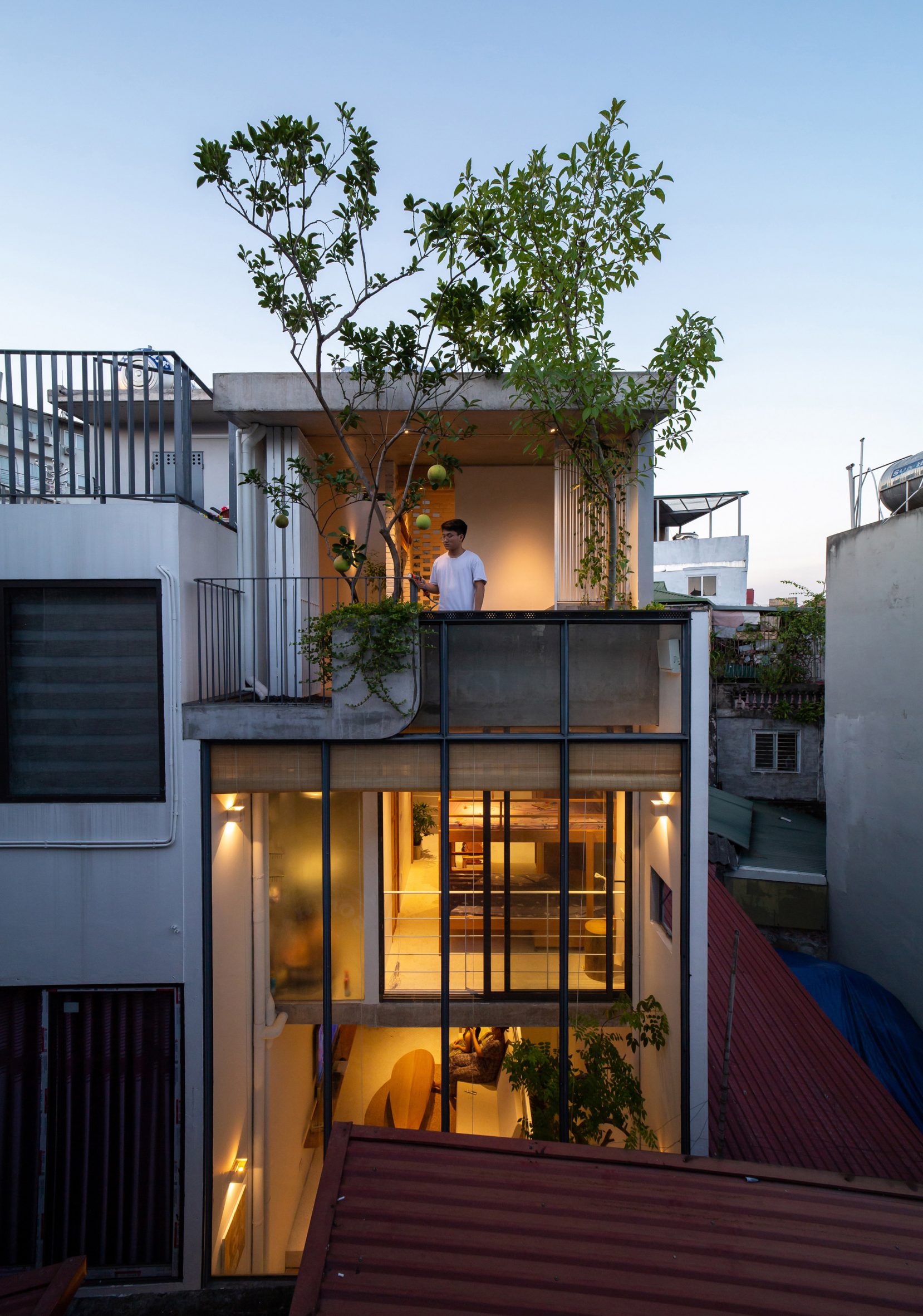 Glazed facade and balcony of TH House by ODDO Architects