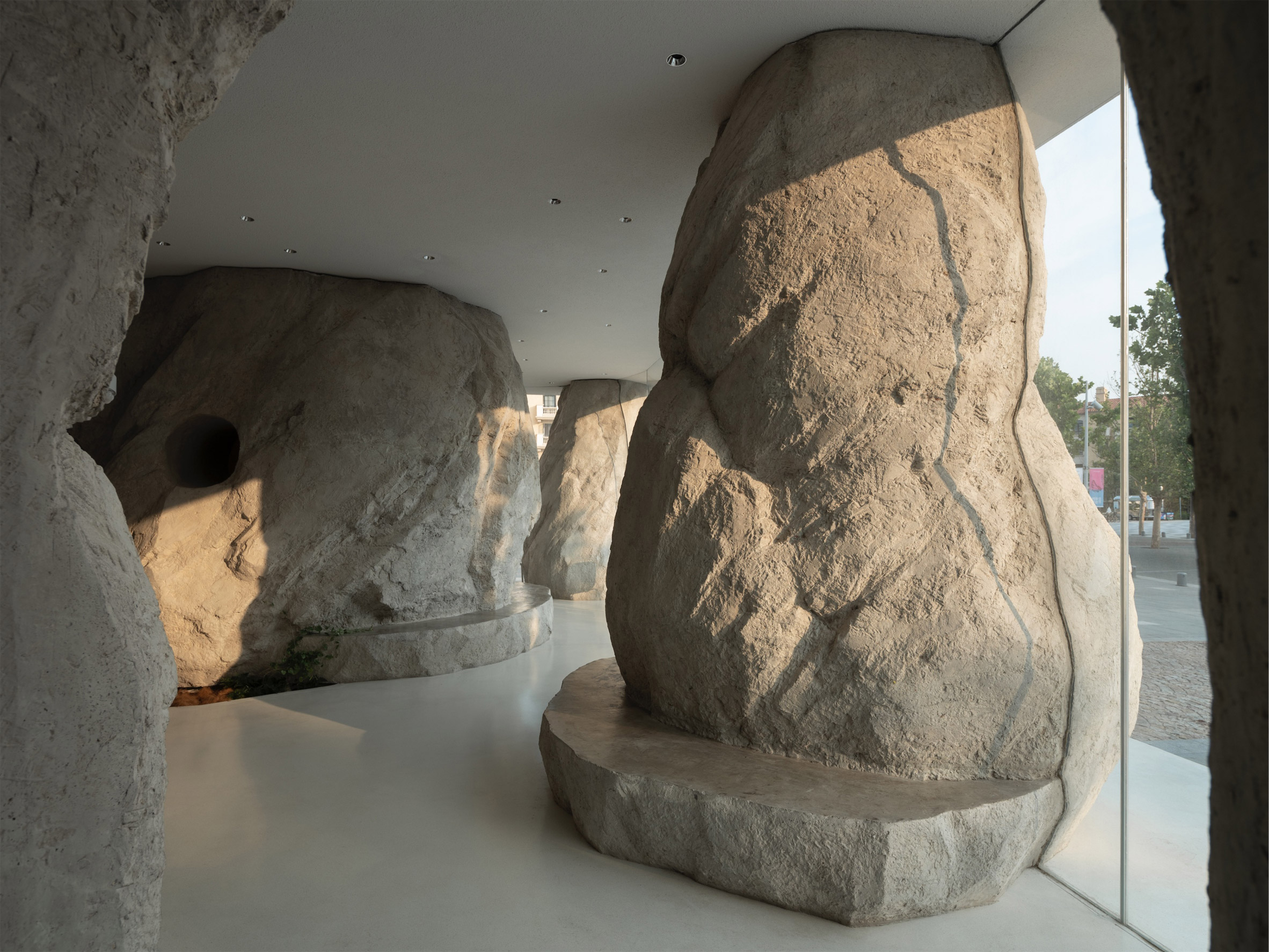 Rock-like columns of cafe in Aranya designed by B.L.U.E. Architecture Studio