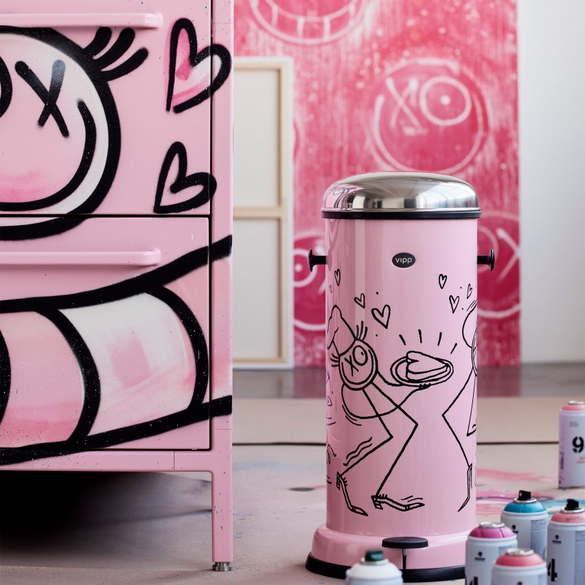 Armour pink kitchen and pedal bin in an artist's studio with spray paint cans scattered