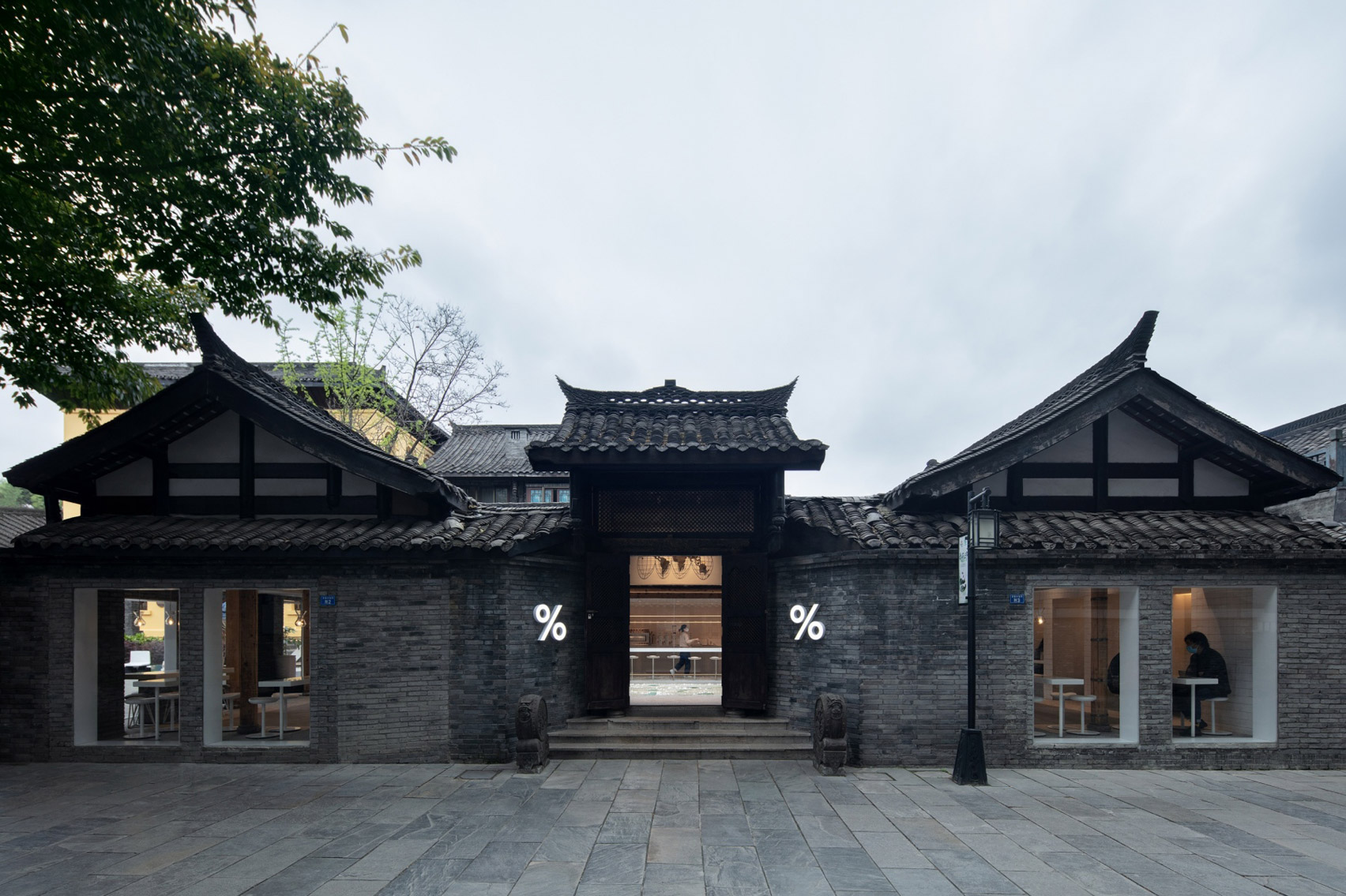 Exterior of % Arabica coffee shop in Chengdy with traditional Chinese roofs