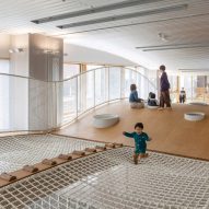 Child playing in Kitakami childcare centre by Unemori architects