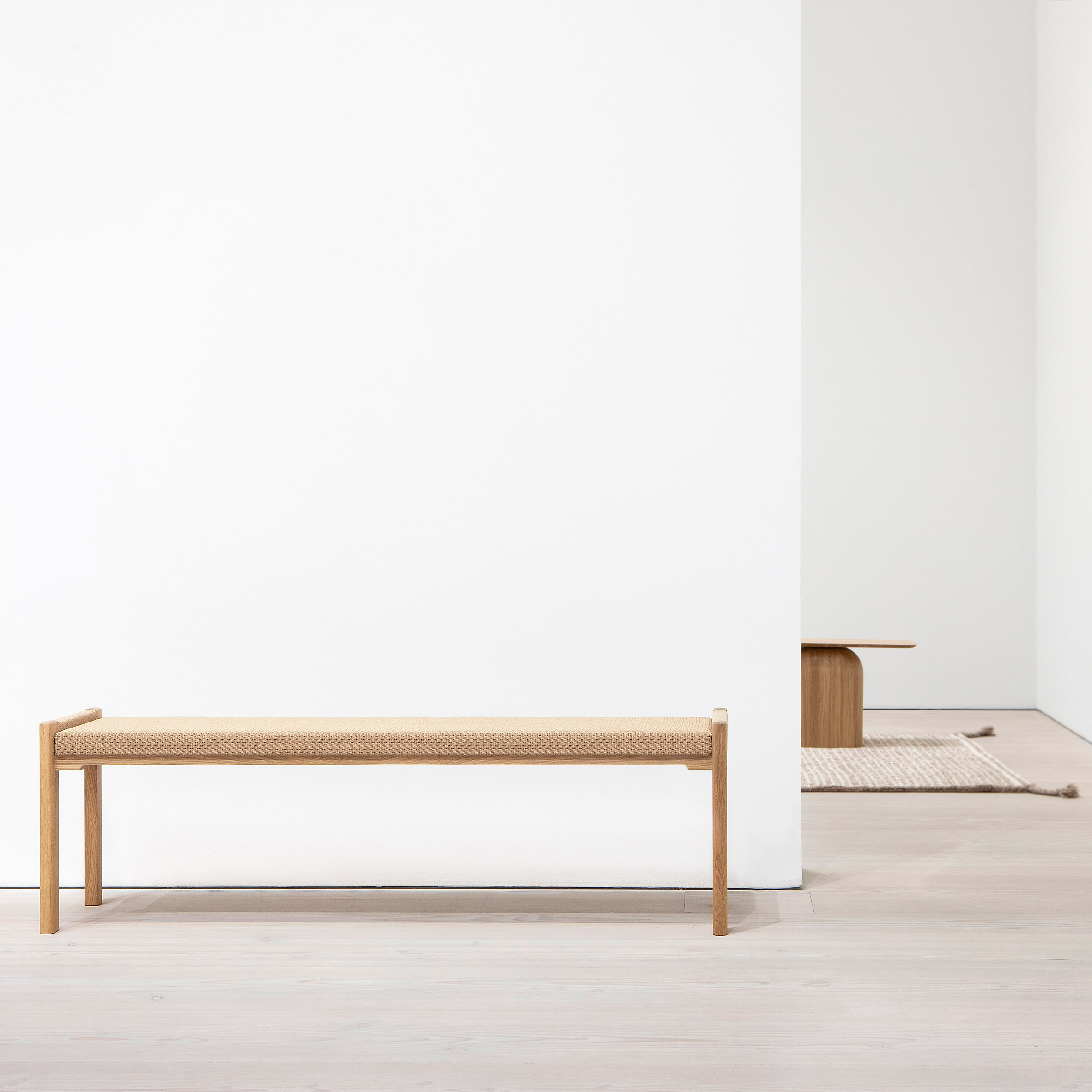 Detalji bench by Nikari against a white wall