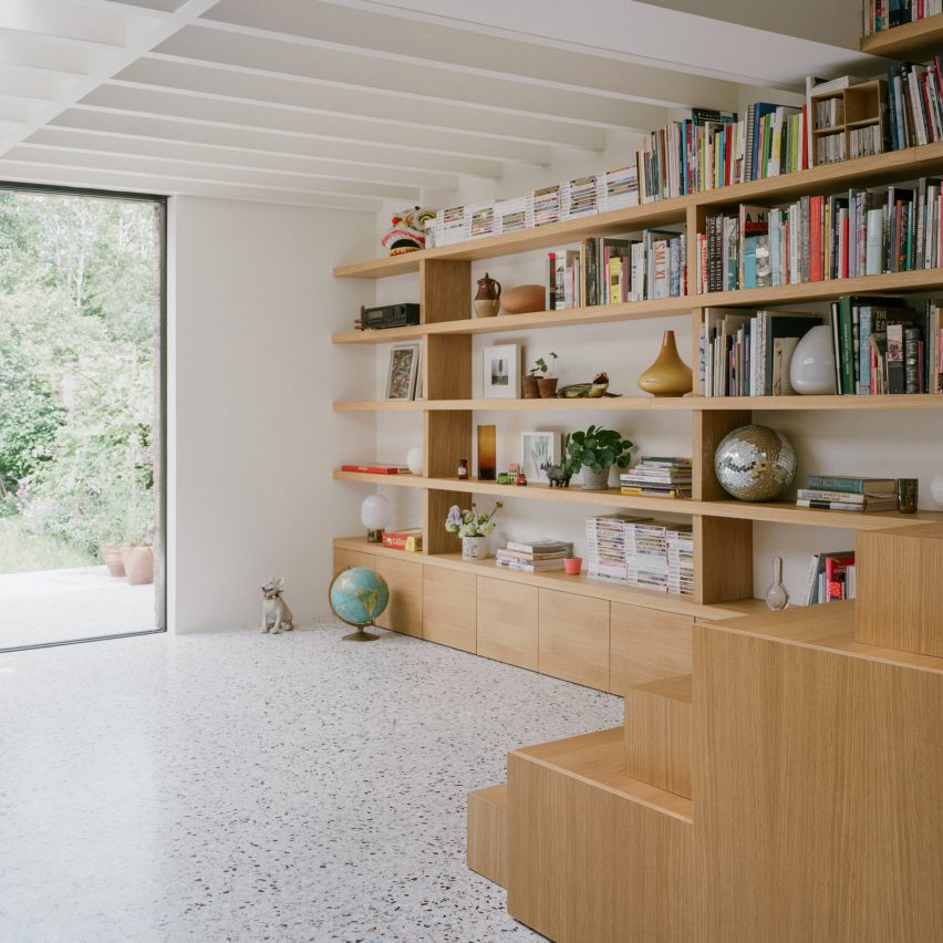 Staircase and bookshelves in Farleigh Road renovation and extension by Paolo Cossu Architects
