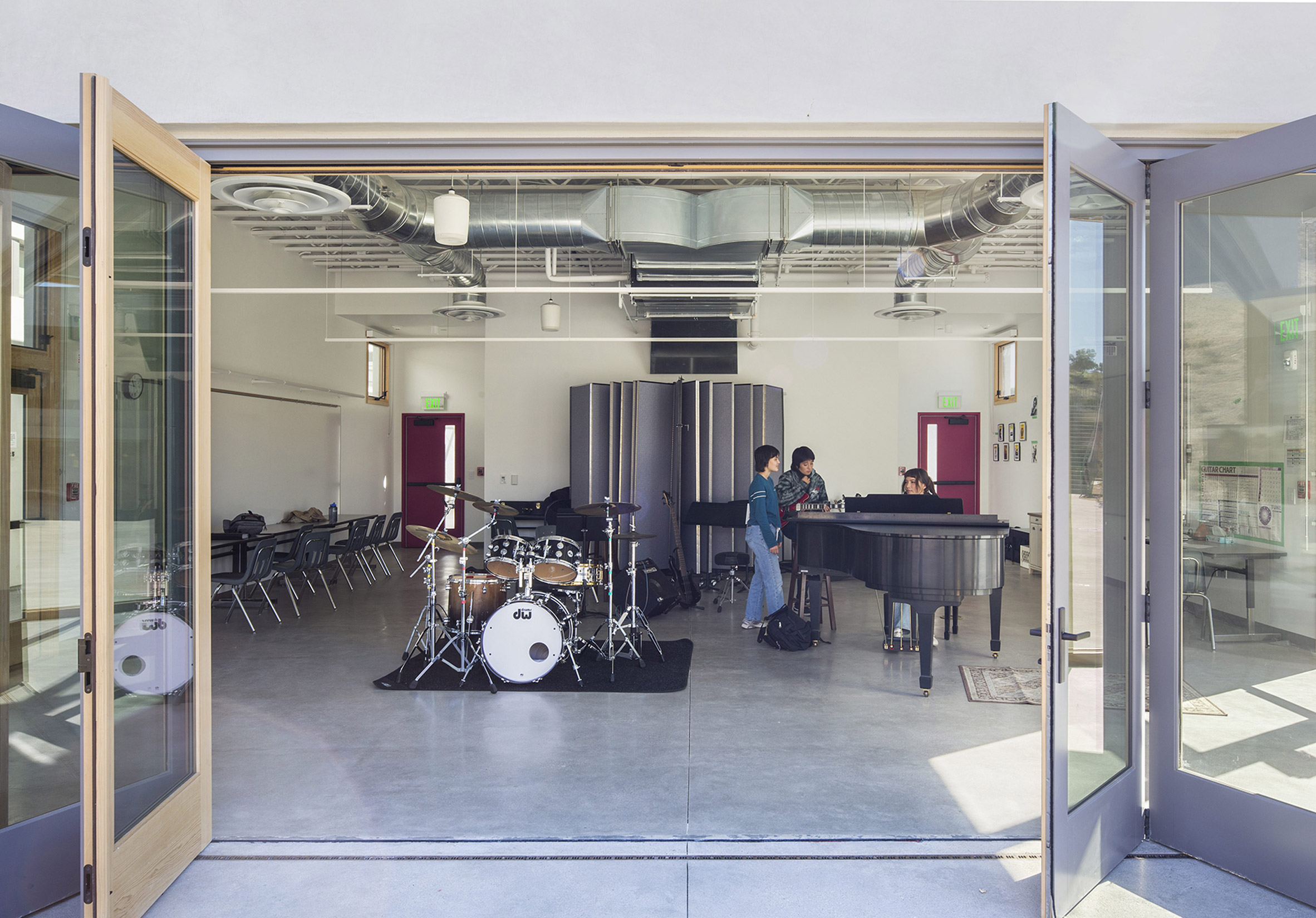 Music room with concrete flooring