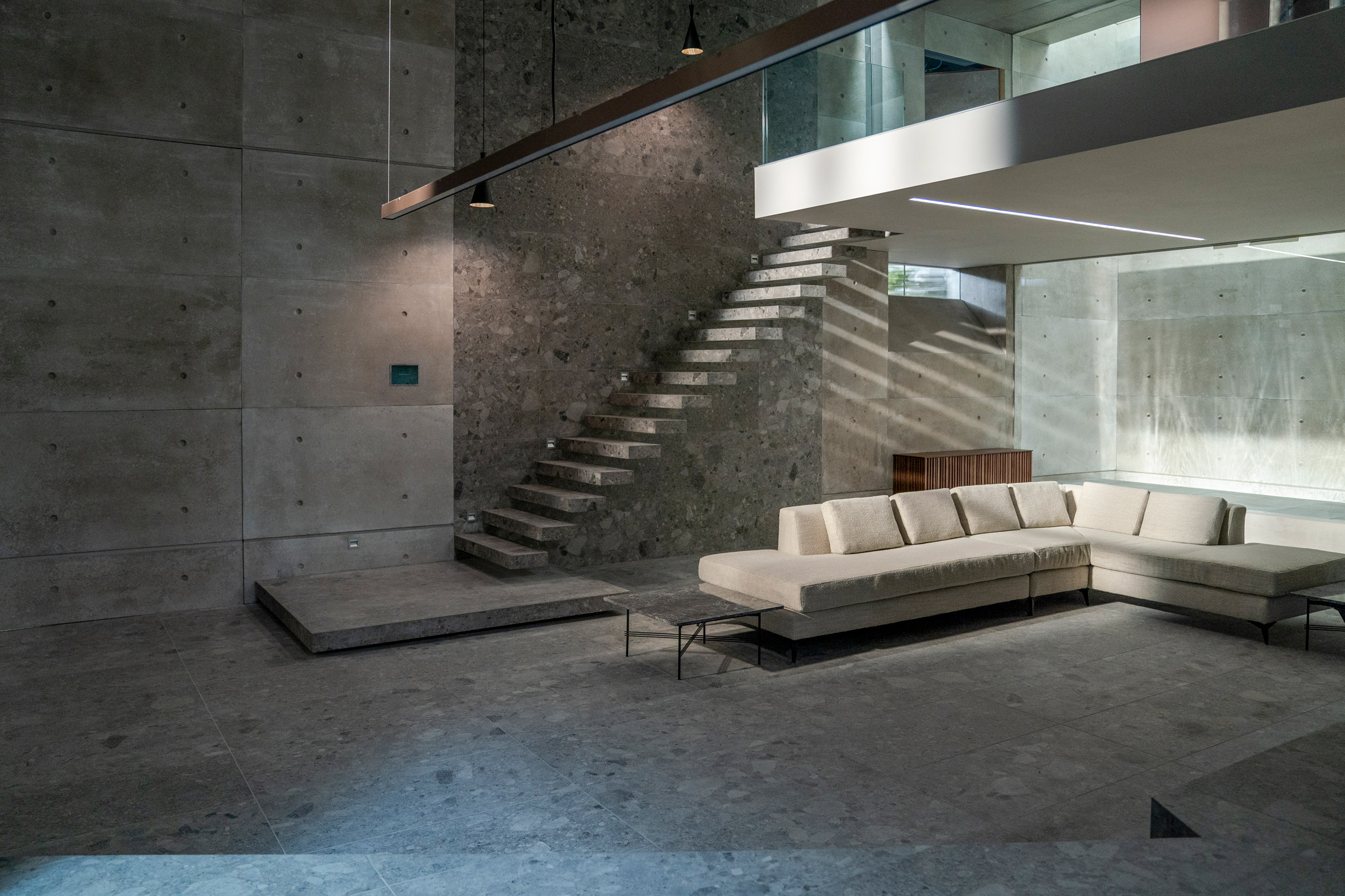 A minimalist, grey toned living room