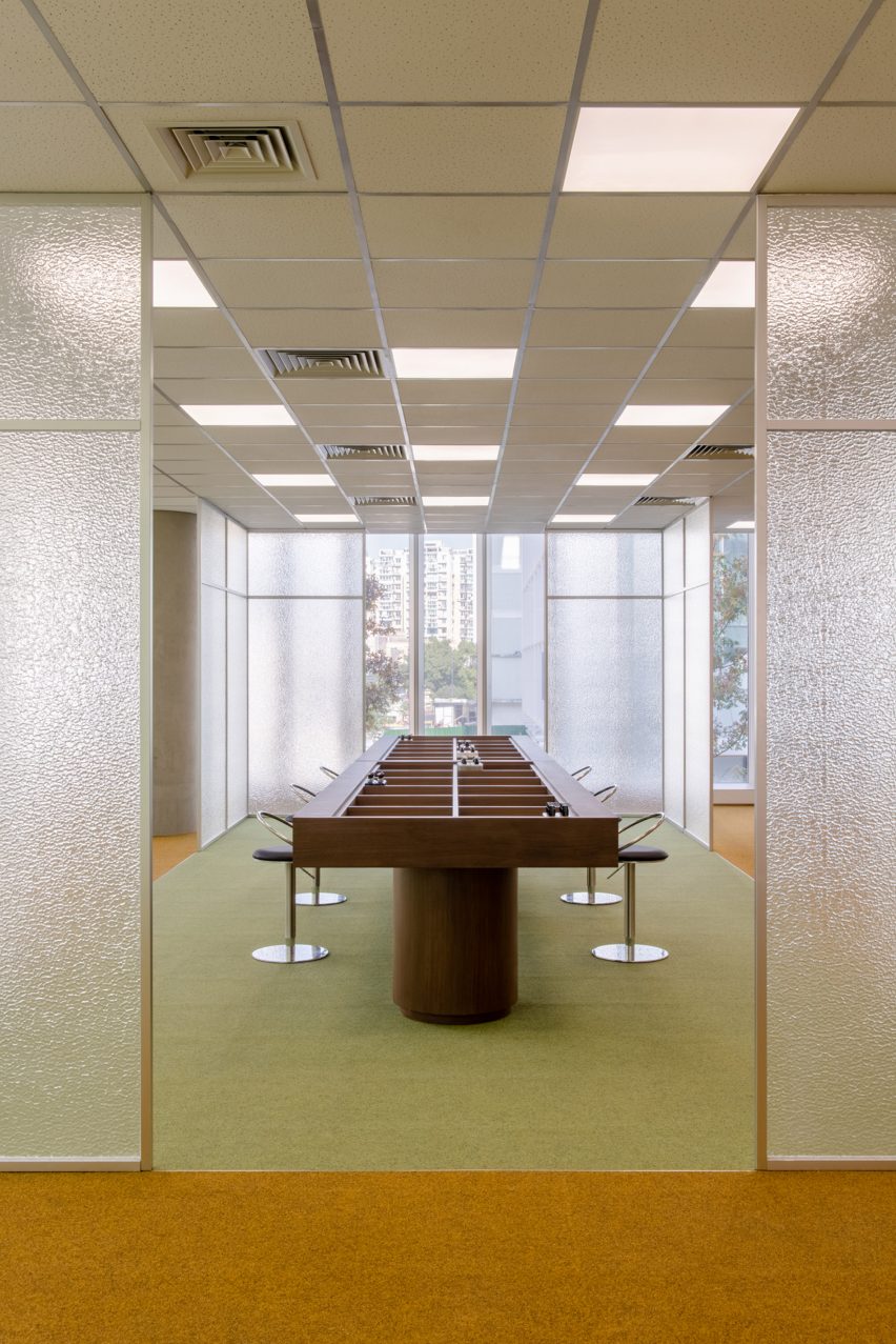 Frosted glass doorway leading into a meeting room