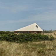 Unknown Architects embeds home in sand dunes on Dutch island