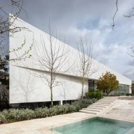 Paritzki & Liani Architects builds triangular house with white stone walls