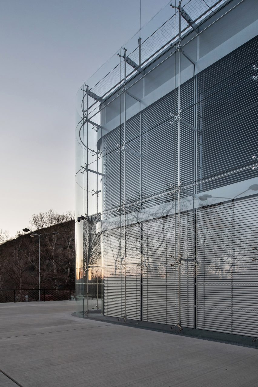 Curved glass wraps around the corner of the Faculty of Humanities at Charles University 