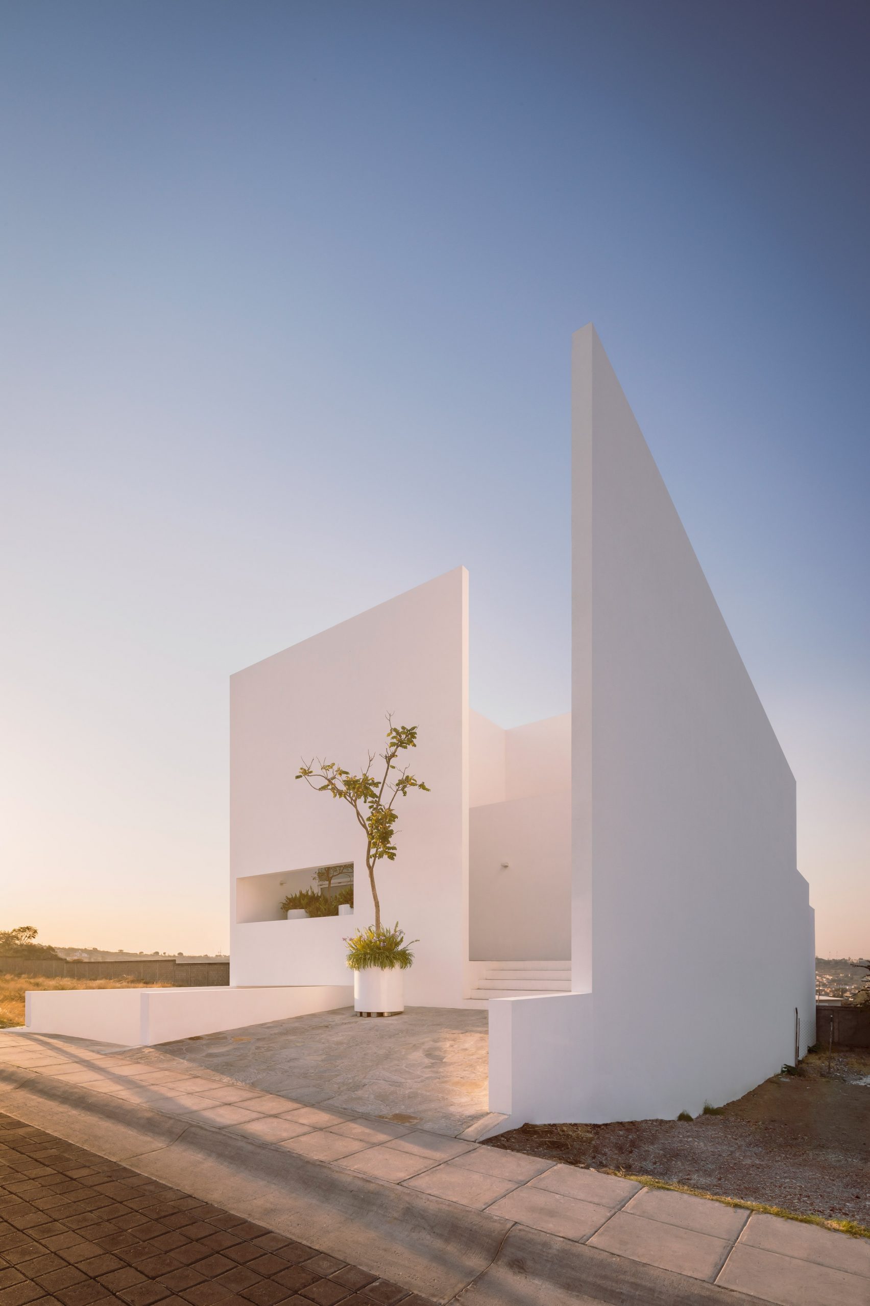 Cotaparedes Arquitectos completes Mexican home built around courtyards