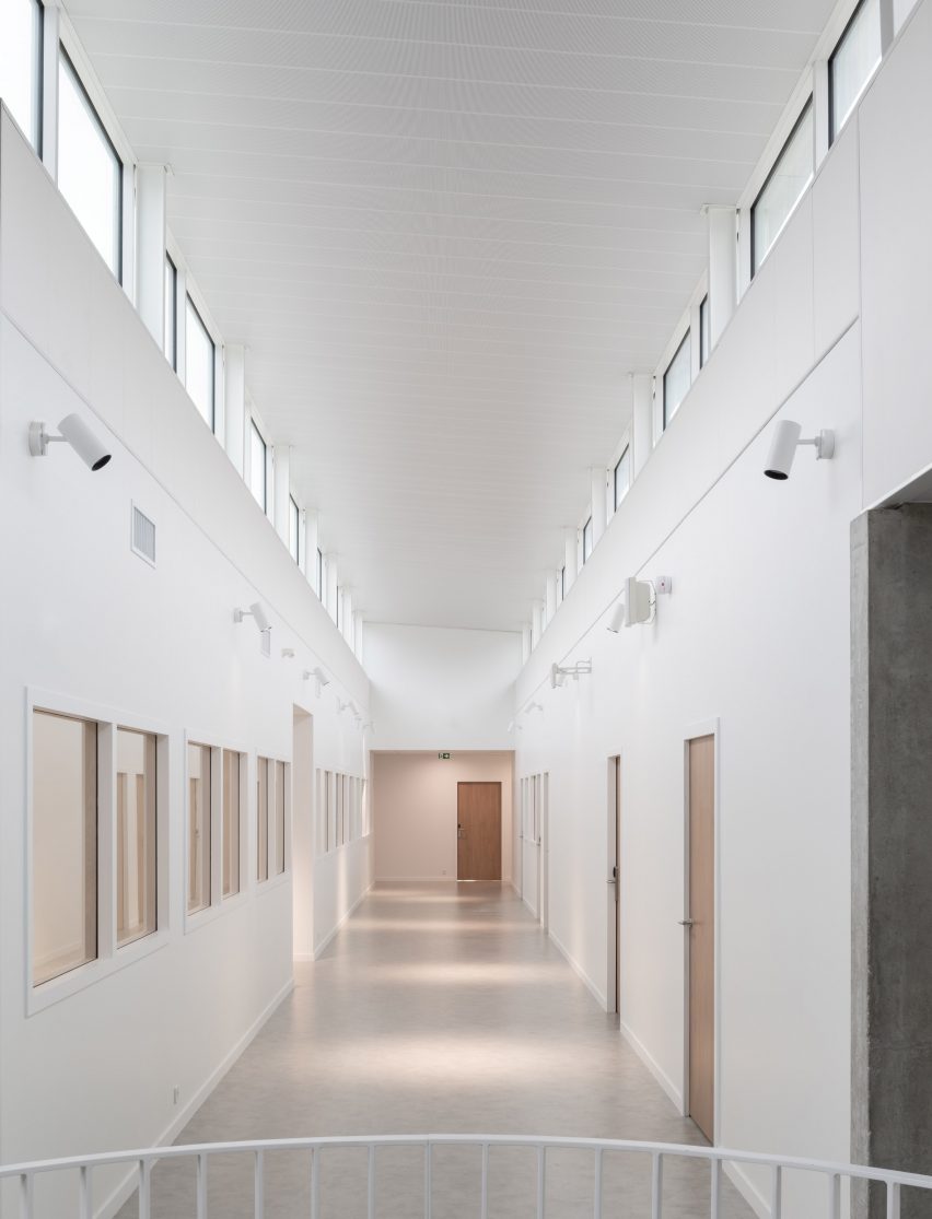 White-painted corridor with clerestory windows