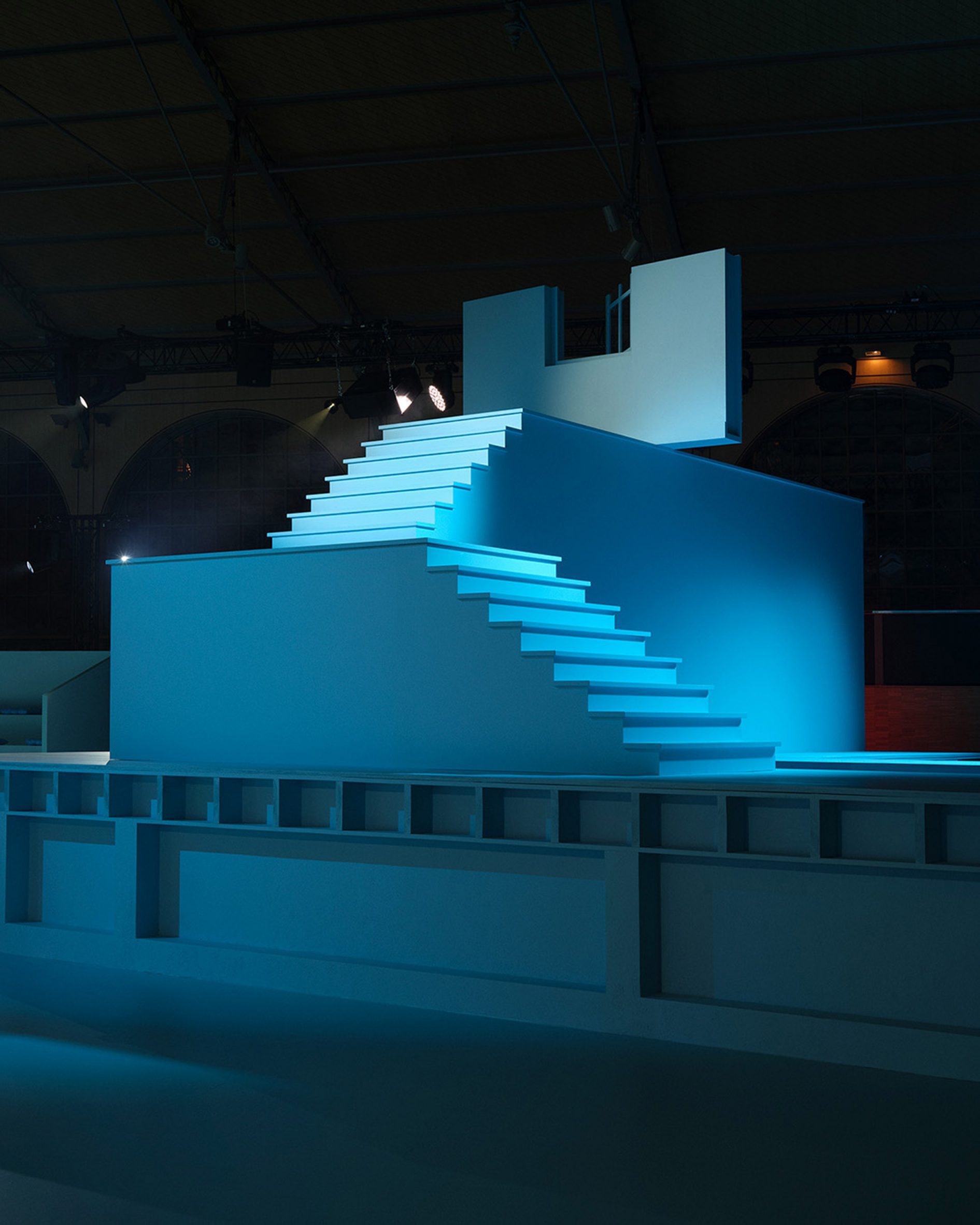Blue painted steps lead to no where at the Louis Vuitton Autumn Winter 2022 show