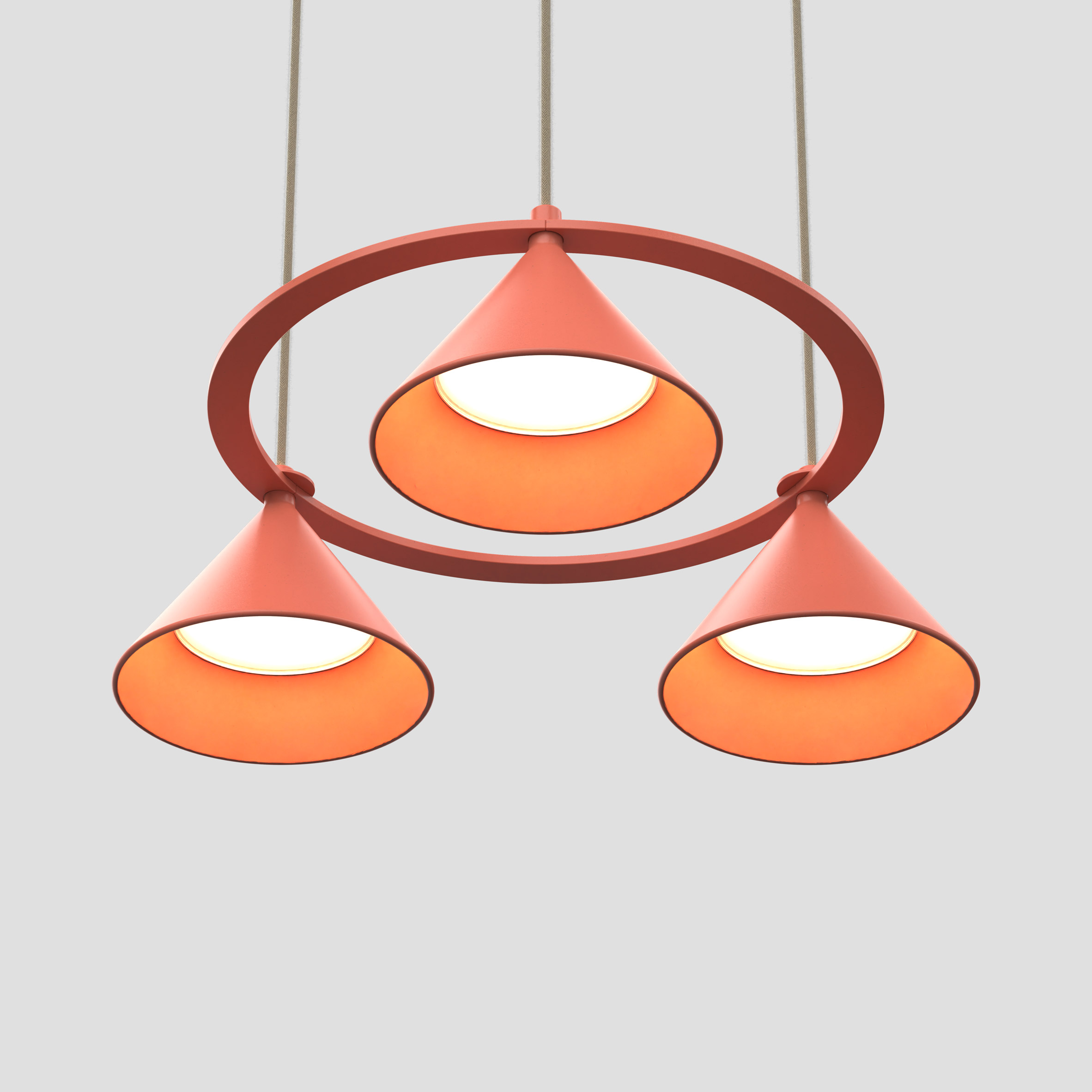 Orange Lumo pendant Lumo by Thomas Bernstrand for Zero Lighting with four conical shades in a circular mount as seen from below