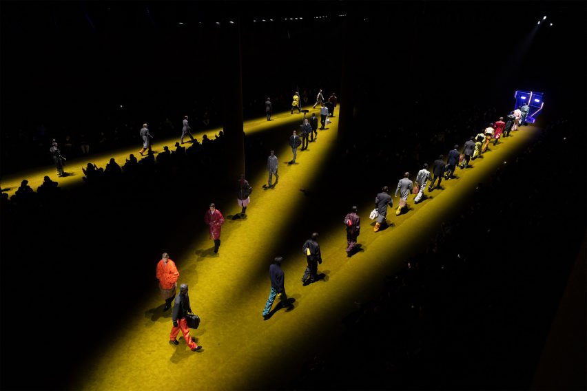 Prada catwalk models walking on green carpet
