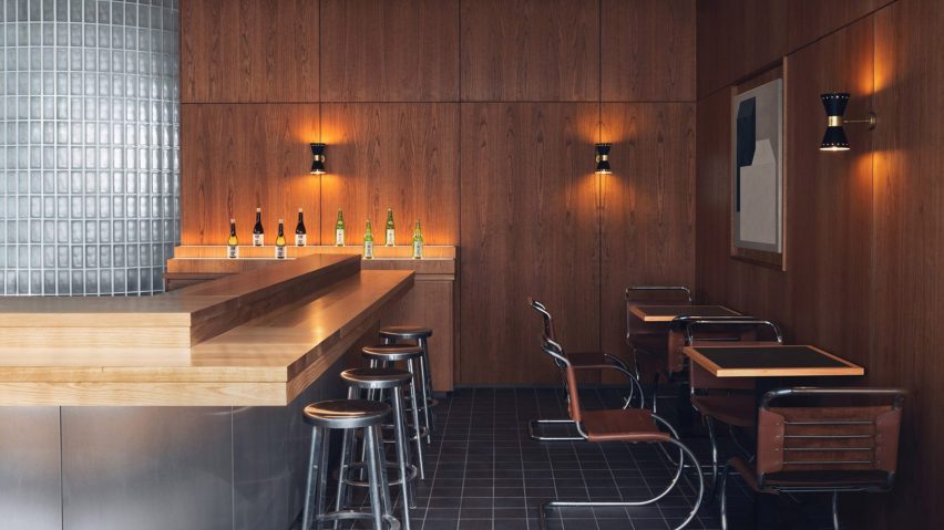 Maido restaurant by Child Studio with wooden counter and glass-block wall