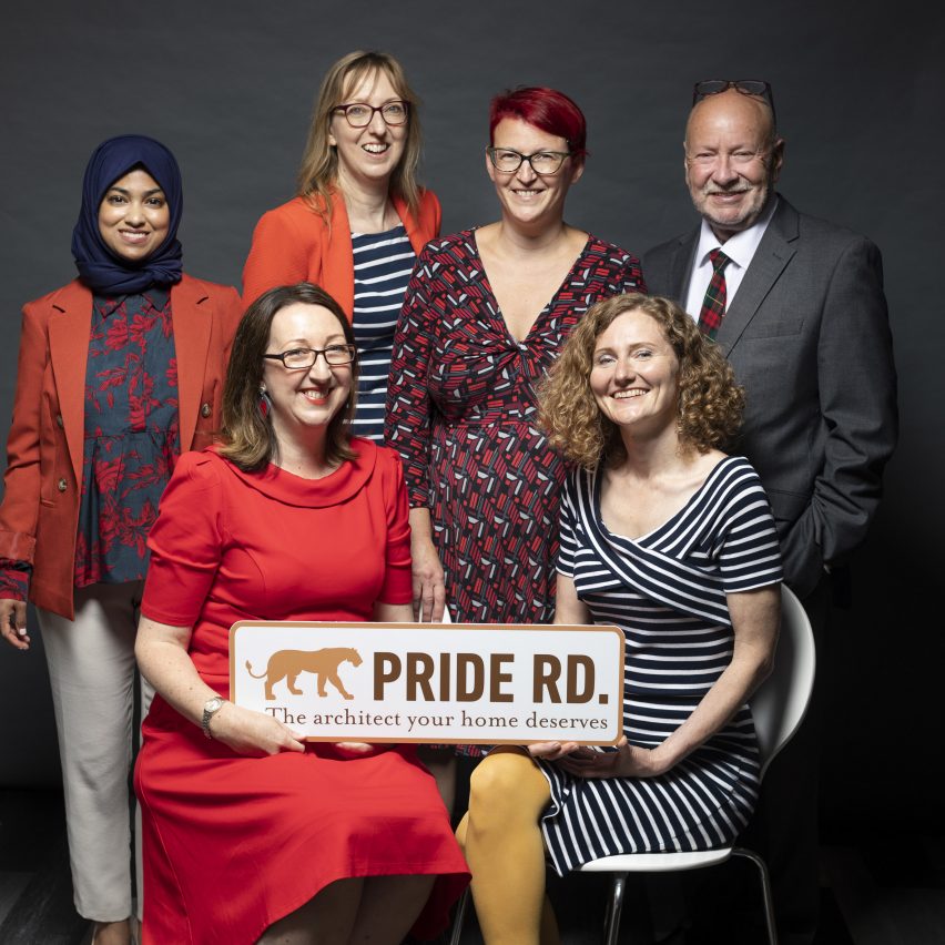 Architects Magda Haener, Laura Simpkins, Lisa Raynes, Sandy Hickey, Shuahra Rahman, Alan Varley holding a Pride Road Architects sign