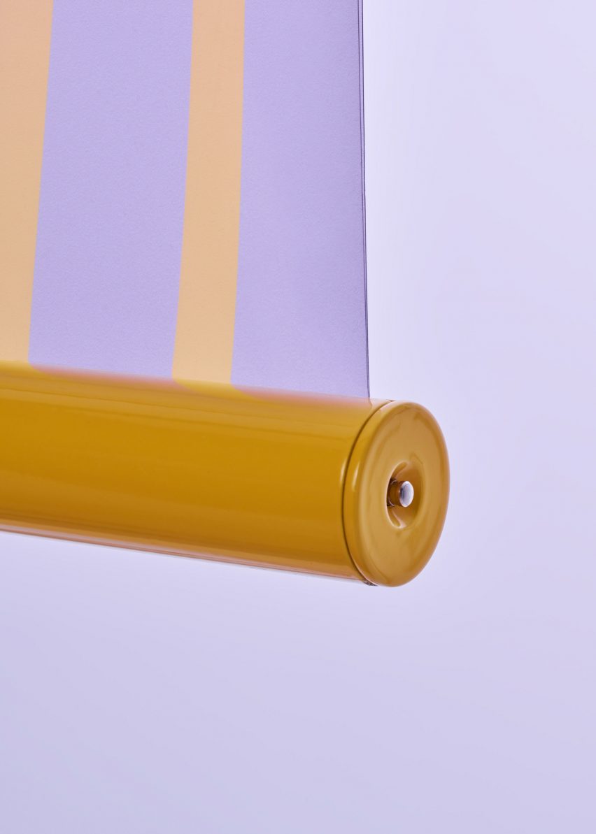 Yellow metal end of transparent solar tapestry by Marjan van Aubel