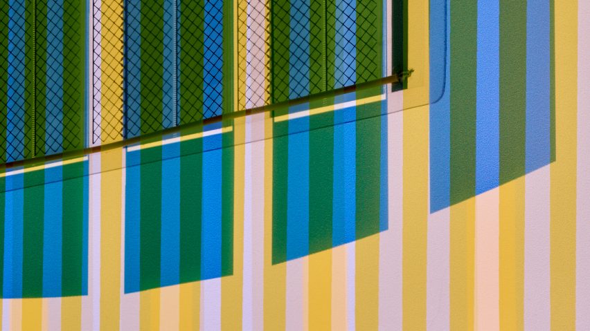 Close-up of organic solar panels in blue, yellow and pink in Ra tapestry by Marjan van Aubel