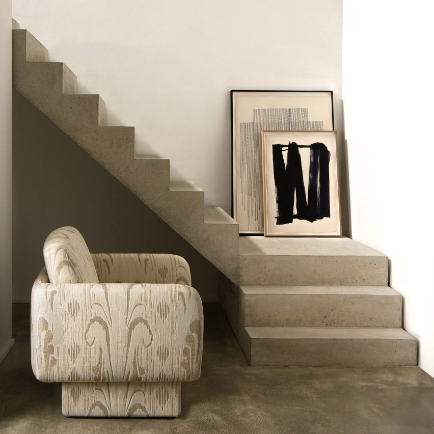 Resonance textiles used on an armchair with a concrete staircase in the background