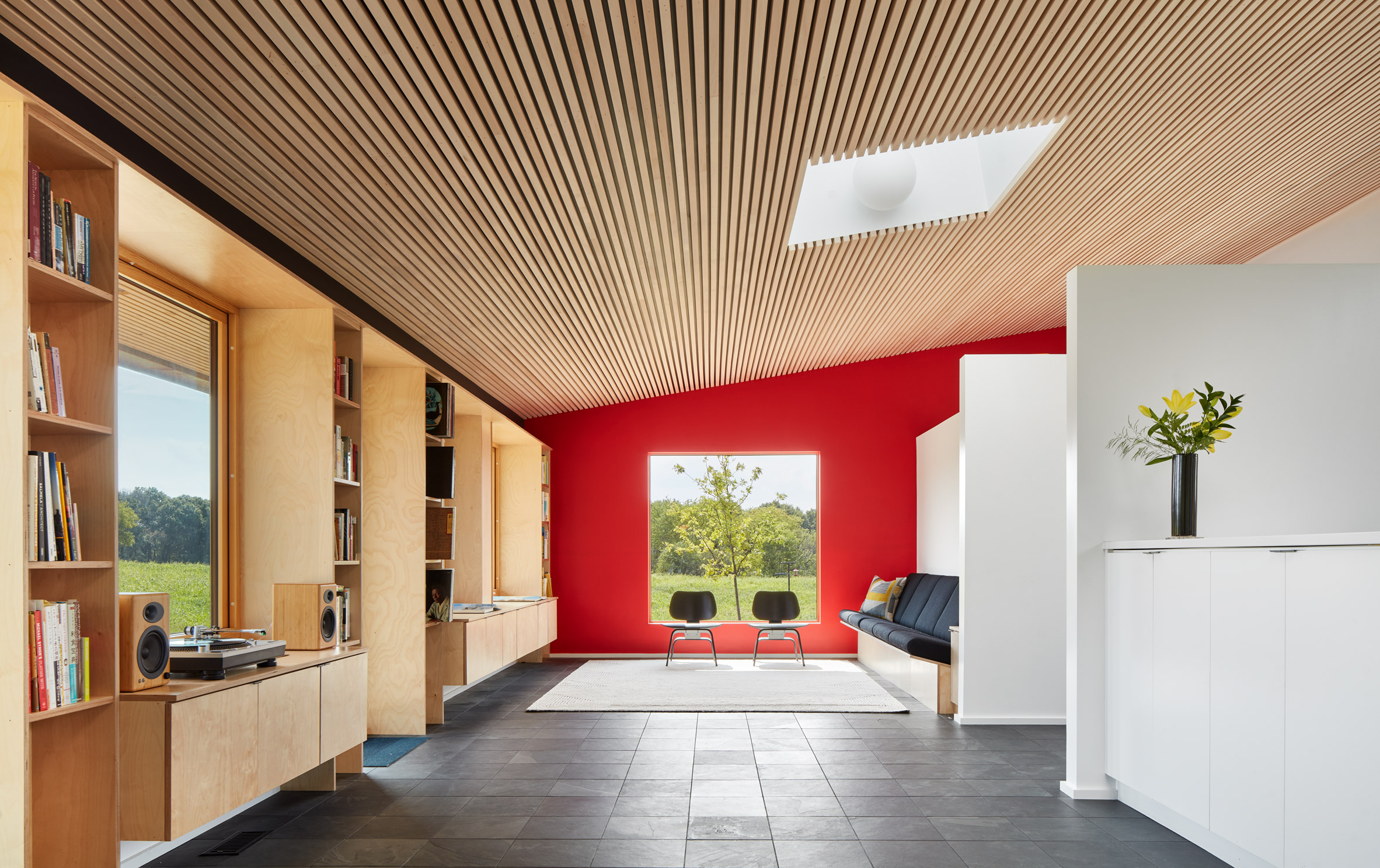 Image of a living area with a timber-lined roof at Fifty-Acre Wood