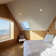 Bedroom with wood-clad walls