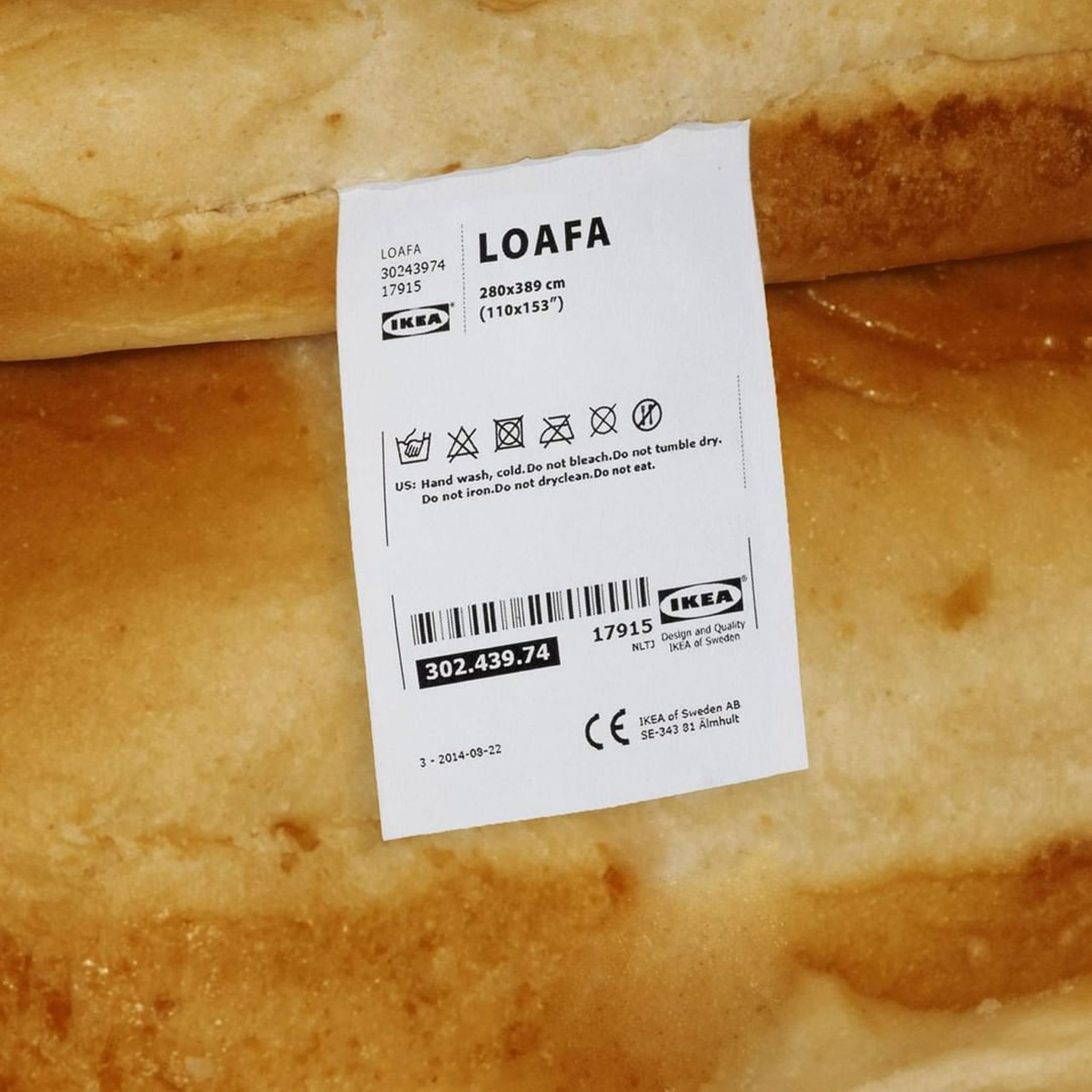 Close-up of mock IKEA tag reading Loafa between two bread loaves