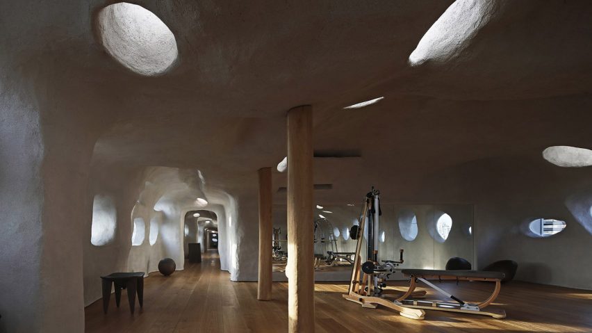 Pilates equipment in cave-like T.T. Pilates studio in Xiamen by Wanmu Shazi with rock-like walls and ceilings