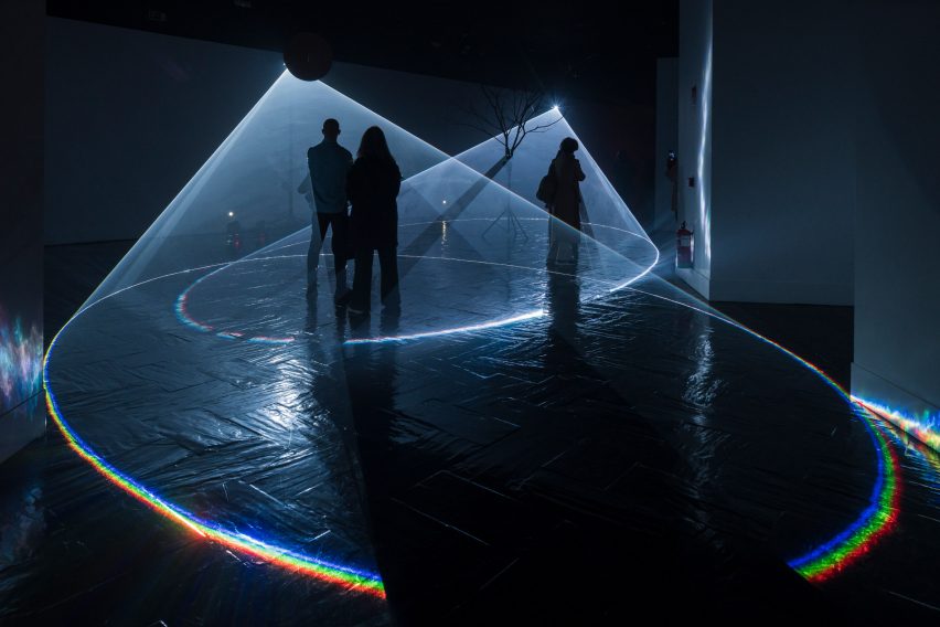 People are pictured inside the light circles at Fiat Lux.3 Architectures of Light