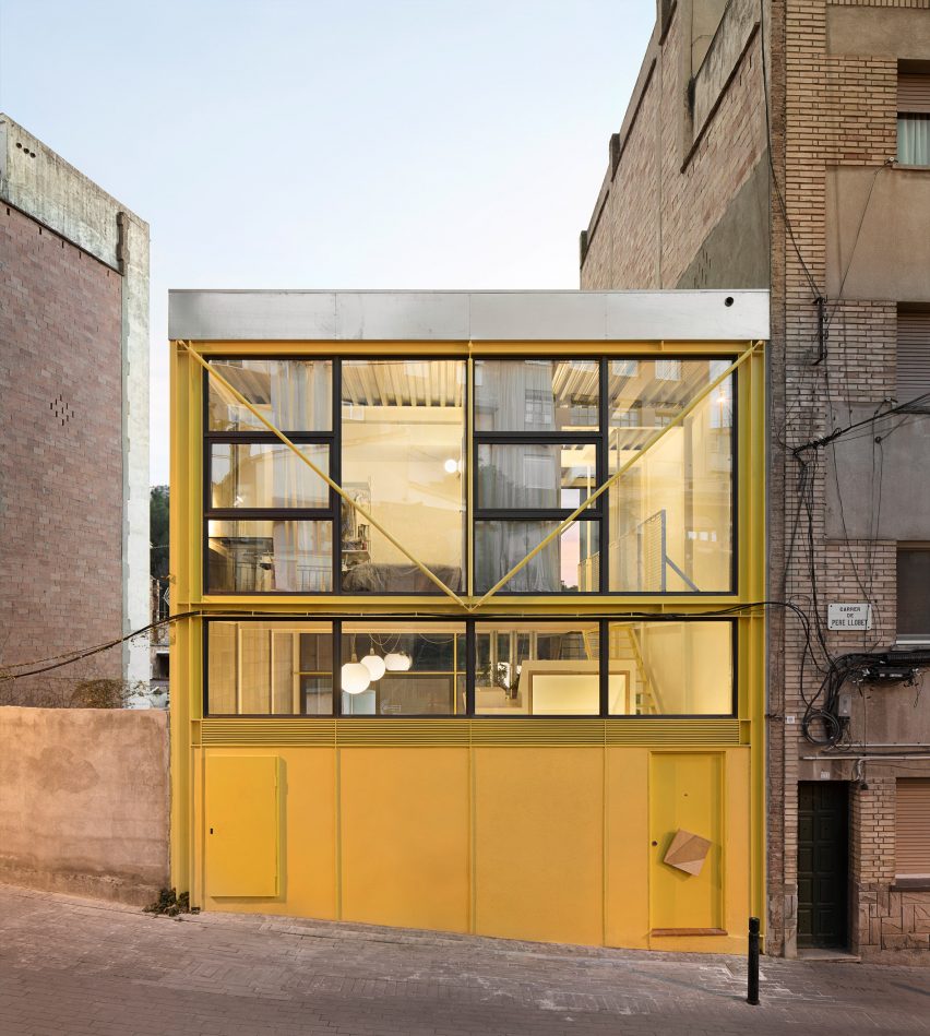 Yellow-steel facade of Casa Collumpio in Barcelona