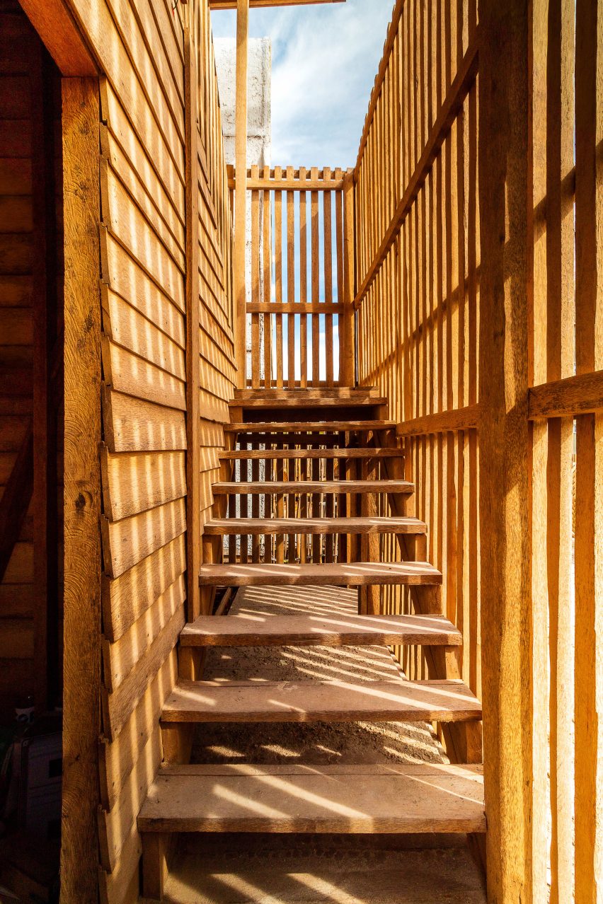 Zapote wood external staircase surrounded by coconut palm timber walls in Casa Numa