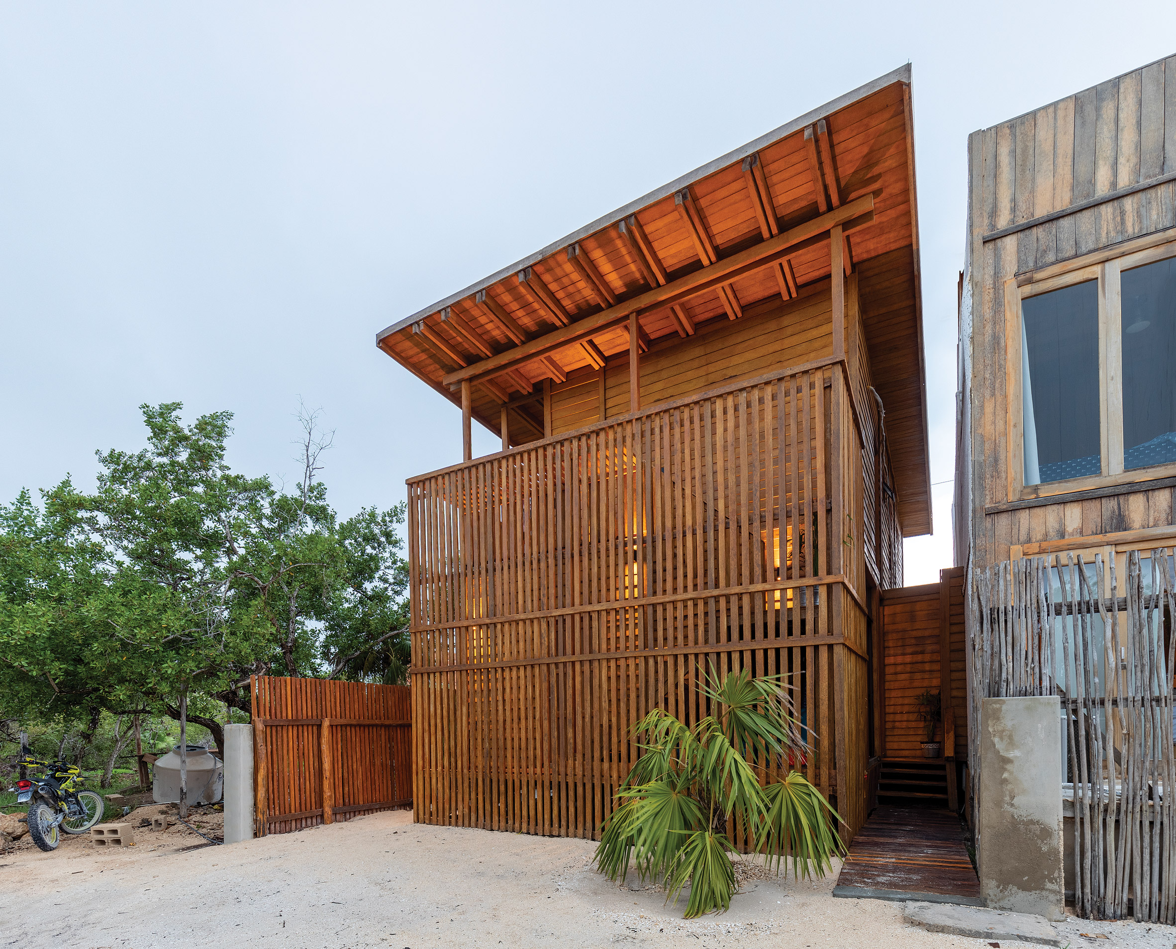 Exterior of Mexican coconut palm wood house wrapped in latticework