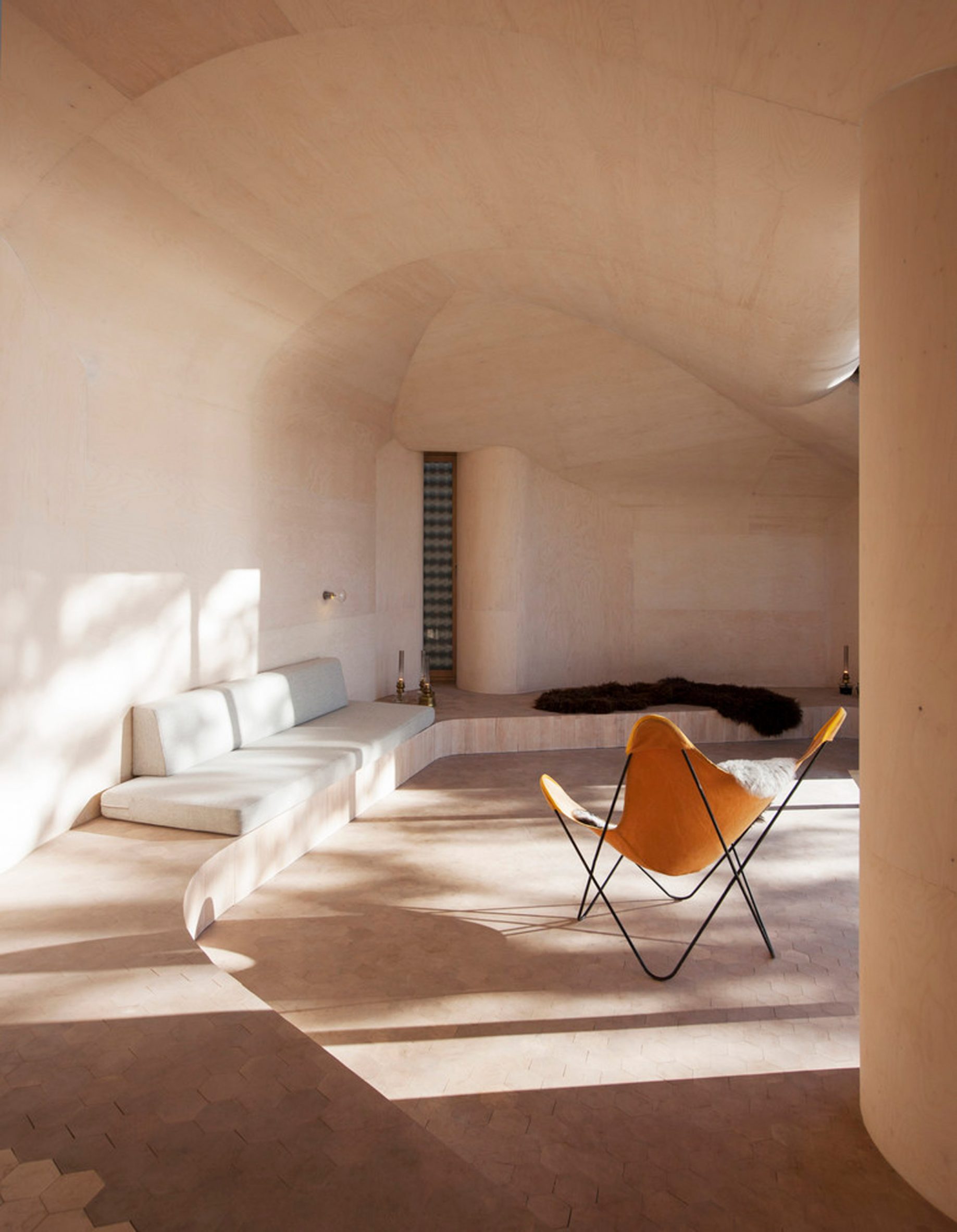 Cave-like interior of Cabin at Norderhov, Norway, by Atelier Oslo